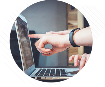 Person pointing at computer screen